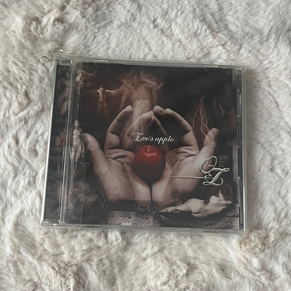 -OZ- - Eve’s Apple